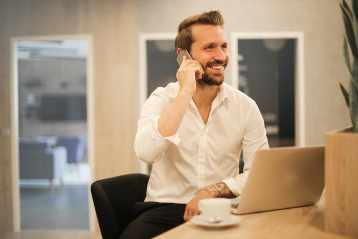 support specialist talking on phone with a client