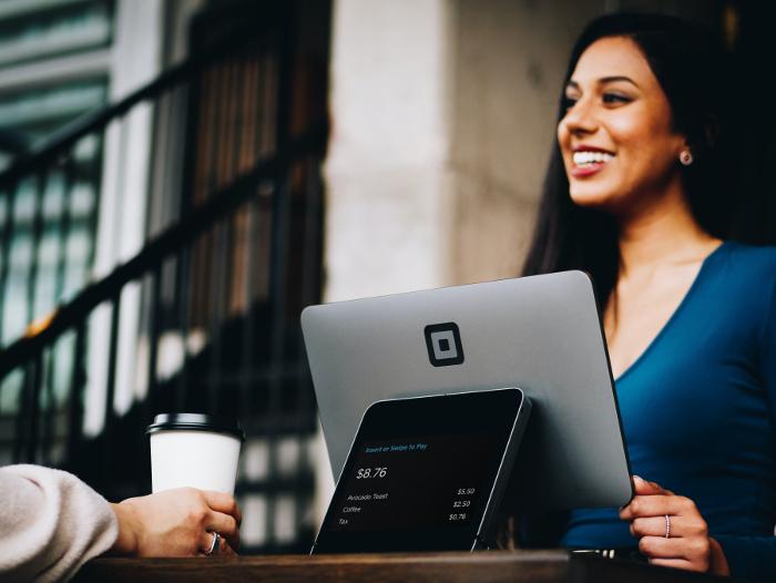 An administrative assistant talking with a colleague