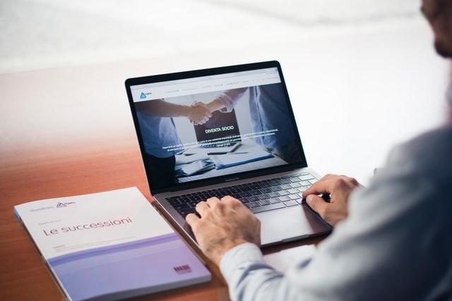 business development representative working on laptop