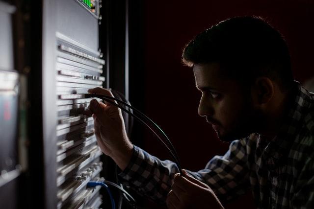 network engineer working using wires