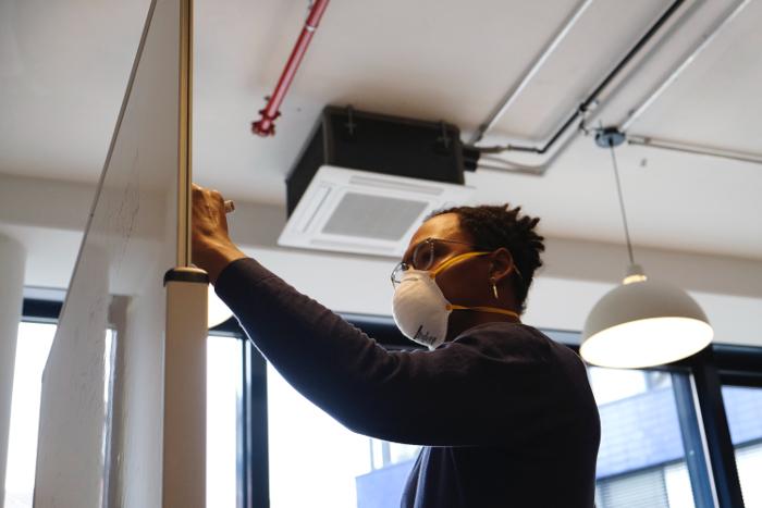 operations manager writing on a board