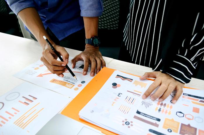 two data analysts working on data