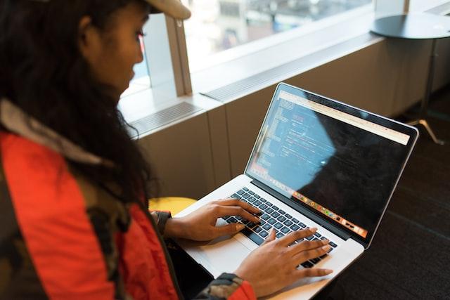 salesforce developer working on a laptop