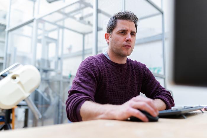 systems engineer working on computer