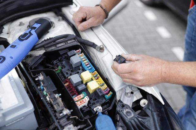 maintenance mechanic repairing a car