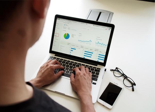 business intelligence analyst working on laptop